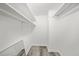 Walk in closet with shelves and wood floors at 12 Dunwoody Springs Dr # 12, Atlanta, GA 30328