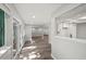 Open living area with wood-look floors, sliding glass doors and seamless flow to the kitchen, great for entertaining at 12 Dunwoody Springs Dr # 12, Atlanta, GA 30328