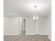 Inviting living room with gray wood-look flooring, modern lighting, and neutral walls, offering a versatile space at 12 Dunwoody Springs Dr # 12, Atlanta, GA 30328