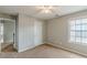 Bedroom with a window, neutral carpet, and grey paint at 150 Alton Cir, Villa Rica, GA 30180