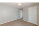 Bedroom with carpet, ceiling fan, and multiple doors at 150 Alton Cir, Villa Rica, GA 30180