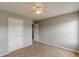 Carpeted bedroom with neutral paint, a ceiling fan, and two closets at 150 Alton Cir, Villa Rica, GA 30180