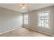 Bedroom showcasing two windows for natural light and a ceiling fan at 150 Alton Cir, Villa Rica, GA 30180