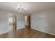 Open-concept dining room flowing into kitchen, featuring stainless steel appliances and a staircase at 150 Alton Cir, Villa Rica, GA 30180