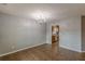 View of the dining room leading to the kitchen with updated appliances at 150 Alton Cir, Villa Rica, GA 30180
