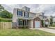 Charming townhome with brick accents, an attached garage, and a well-maintained lawn at 150 Alton Cir, Villa Rica, GA 30180