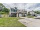 Townhome featuring a manicured lawn and attached garage at 150 Alton Cir, Villa Rica, GA 30180