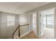 Second floor hallway with carpet and railing leading to other bedrooms at 150 Alton Cir, Villa Rica, GA 30180