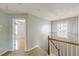 Hallway with view into bedroom and a stairway at 150 Alton Cir, Villa Rica, GA 30180