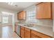 Well-lit kitchen with stainless steel dishwasher and a view into the dining area at 150 Alton Cir, Villa Rica, GA 30180