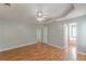 Large main bedroom with hardwood floors, a ceiling fan, and an attached bathroom at 150 Alton Cir, Villa Rica, GA 30180