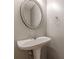 Bathroom featuring a pedestal sink and modern mirror at 150 Alton Cir, Villa Rica, GA 30180