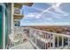 Balcony with skyline views and a modern white chair at 250 Pharr Ne Rd # 1112, Atlanta, GA 30305