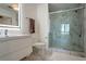 Modern bathroom featuring a marble-accented glass shower and sleek vanity at 250 Pharr Ne Rd # 1112, Atlanta, GA 30305