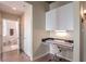 Cozy home office space featuring a built-in desk, stylish decor, and access to the bathroom at 250 Pharr Ne Rd # 1112, Atlanta, GA 30305