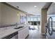 Modern kitchen with stainless steel appliances and an open layout leading to the living area at 250 Pharr Ne Rd # 1112, Atlanta, GA 30305