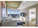 Bright living room with floor-to-ceiling windows offering city views and an open layout to the bedroom at 250 Pharr Ne Rd # 1112, Atlanta, GA 30305
