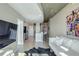 Open-concept living space with hardwood floors, modern artwork, and expansive city views at 250 Pharr Ne Rd # 1112, Atlanta, GA 30305