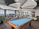 Elegant lounge area with a pool table, stylish seating, and modern lighting at 250 Pharr Ne Rd # 1112, Atlanta, GA 30305