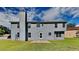 The backyard has a large grass lawn and the house has gray siding at 4706 Derby Loop, Fairburn, GA 30213
