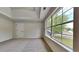 Bright bedroom features large windows, neutral carpet, and tray ceiling at 4706 Derby Loop, Fairburn, GA 30213