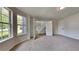 Bright bedroom with multiple windows and plush carpeting at 4706 Derby Loop, Fairburn, GA 30213