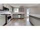 Modern kitchen featuring gray cabinets, stainless steel appliances, and granite countertops at 4706 Derby Loop, Fairburn, GA 30213