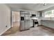 Modern kitchen features gray cabinets, stainless steel appliances, and granite countertops at 4706 Derby Loop, Fairburn, GA 30213