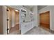 Elegant main bathroom featuring double sinks, stylish lighting, and walk-in closets at 4706 Derby Loop, Fairburn, GA 30213