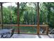 Wood deck with a metal fence and a forest background at 8 Ripplewood Trl, Euharlee, GA 30145