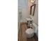 Cozy bathroom features a shower, a pedestal sink, and wood look tile floors at 8 Ripplewood Trl, Euharlee, GA 30145