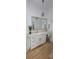 Bright bathroom featuring double vanity with white cabinets and granite countertop and a make up desk area at 8 Ripplewood Trl, Euharlee, GA 30145