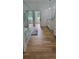 Spacious bathroom features frameless shower, hardwood floors, white vanity, and modern fixtures at 8 Ripplewood Trl, Euharlee, GA 30145