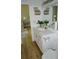 Bathroom featuring a small vanity with granite countertop, toilet and access to another room at 8 Ripplewood Trl, Euharlee, GA 30145