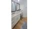 Spacious bathroom featuring double vanity with white cabinets and granite countertop and a make up desk area at 8 Ripplewood Trl, Euharlee, GA 30145