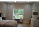Bright bedroom features hardwood floors, a window and neutral décor at 8 Ripplewood Trl, Euharlee, GA 30145