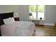 Bedroom featuring a full bed with a window and table and television stand at 8 Ripplewood Trl, Euharlee, GA 30145