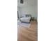 Bright bedroom featuring a full bed with grey rug, and two nightstands with wood flooring at 8 Ripplewood Trl, Euharlee, GA 30145
