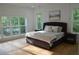 Bright bedroom features large windows and hardwood floors at 8 Ripplewood Trl, Euharlee, GA 30145