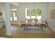 Bright dining room boasts a light wood floor and a large window view of outdoors at 8 Ripplewood Trl, Euharlee, GA 30145