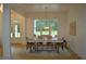 Dining room with large windows, pendant lighting, and seating for six with bench at 8 Ripplewood Trl, Euharlee, GA 30145