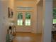 Bright entryway featuring a double door entry, hardwood floors, and modern decorations at 8 Ripplewood Trl, Euharlee, GA 30145