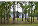 Large white home nestled among the trees with a spacious lawn at 8 Ripplewood Trl, Euharlee, GA 30145