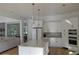 Modern kitchen featuring white cabinets, stainless steel appliances, and a center island at 8 Ripplewood Trl, Euharlee, GA 30145