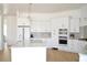 Beautiful kitchen with white cabinets, stainless steel appliances, and a kitchen island at 8 Ripplewood Trl, Euharlee, GA 30145