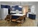 Contemporary kitchen featuring navy cabinets, white countertops, and center island seating at 8 Ripplewood Trl, Euharlee, GA 30145