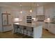 A stunning kitchen with an island, ample cabinet space, and stainless steel appliances at 8 Ripplewood Trl, Euharlee, GA 30145