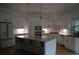Bright, spacious kitchen with white cabinets, stainless steel appliances, and a center island at 8 Ripplewood Trl, Euharlee, GA 30145