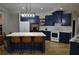 Elegant kitchen showcasing blue cabinetry, stainless steel appliances, and a large island at 8 Ripplewood Trl, Euharlee, GA 30145