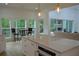 Gorgeous kitchen with stainless steel appliances, white cabinets, and a sunlit eat-in area at 8 Ripplewood Trl, Euharlee, GA 30145